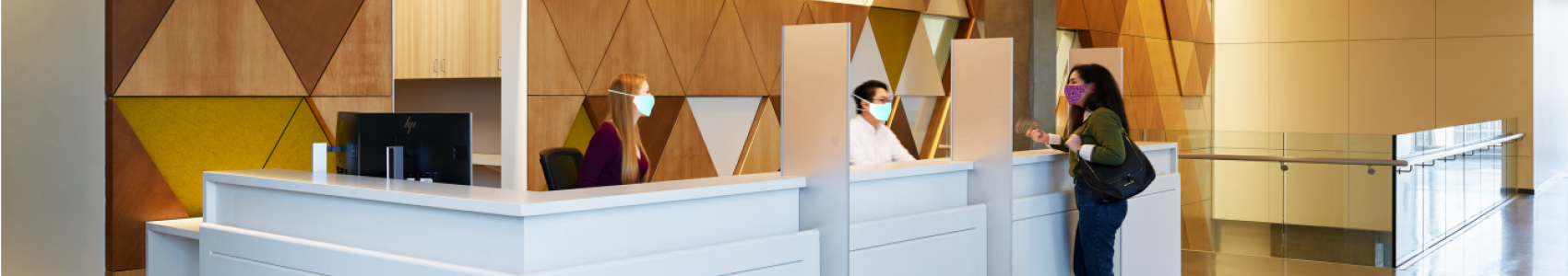 Image of a patient at a reception desk